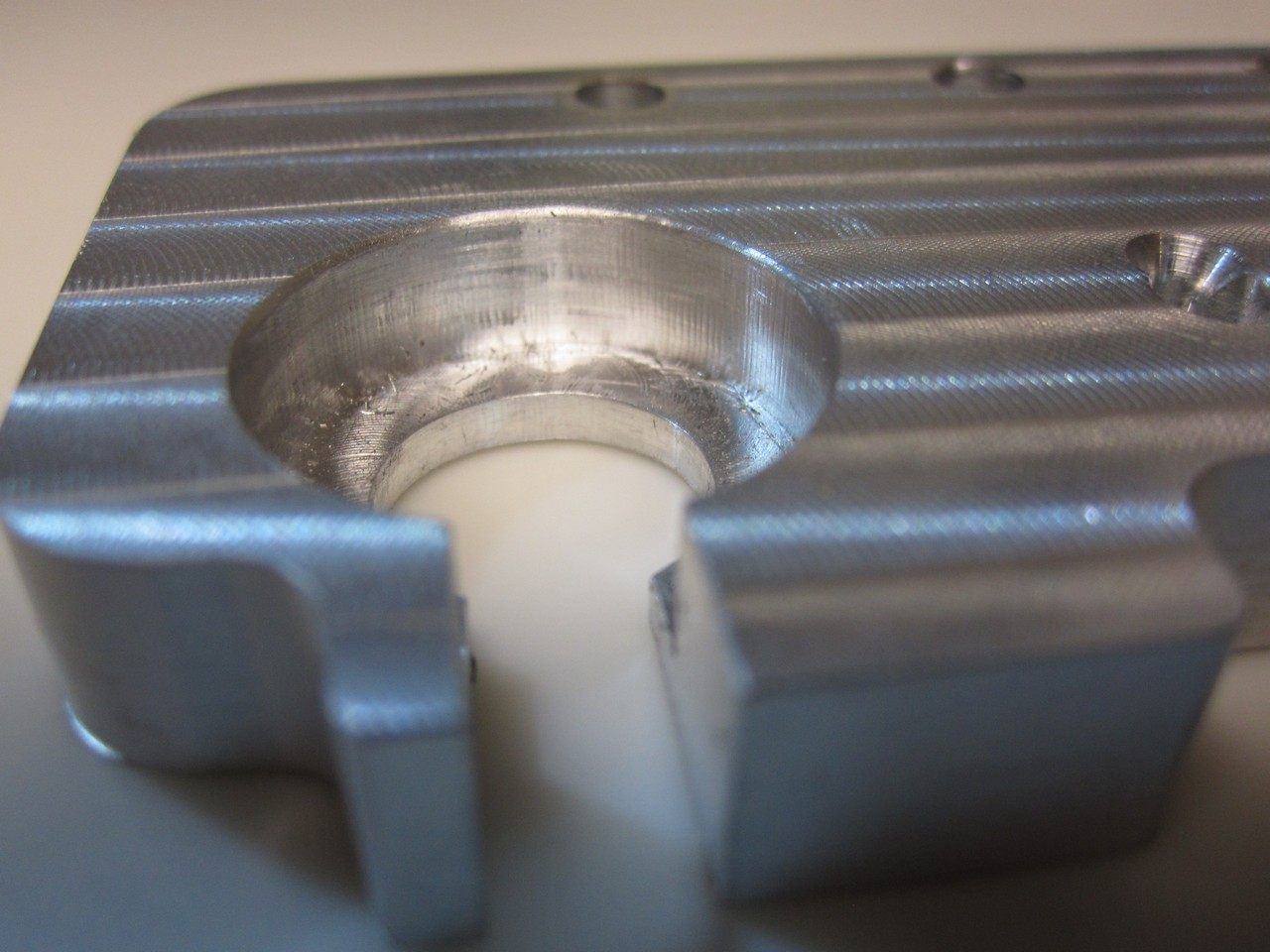 The bore holds the snout of a Proxxon tool.