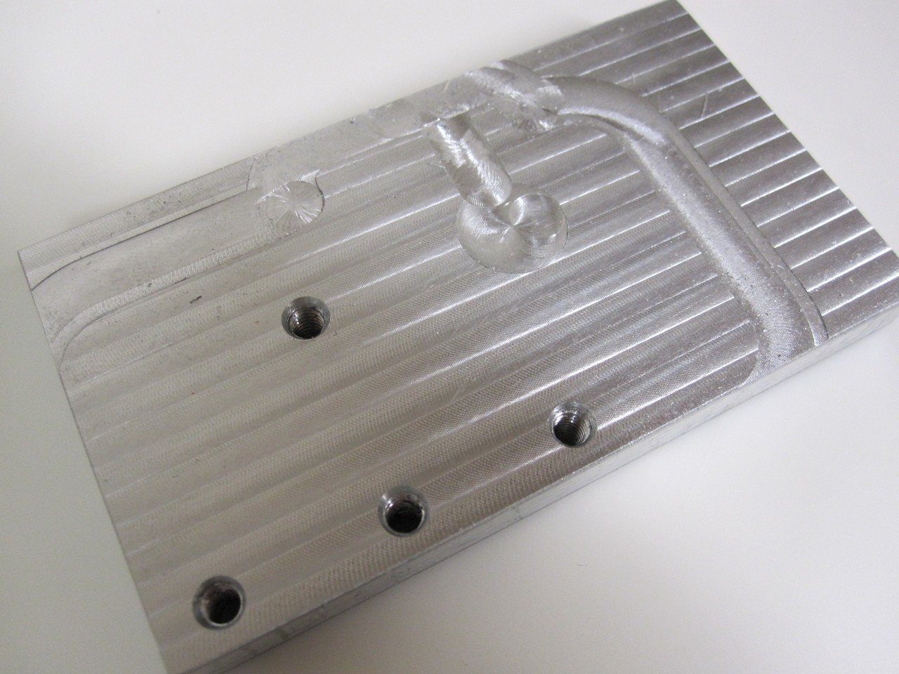 The fixturing plate used to hold the workpiece.