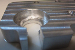 The bore holds the snout of a Proxxon tool.