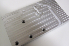 The fixturing plate used to hold the workpiece.