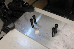 Fixture plate, after drilling.  This scrap of 1/4" aluminum will hold the work piece.